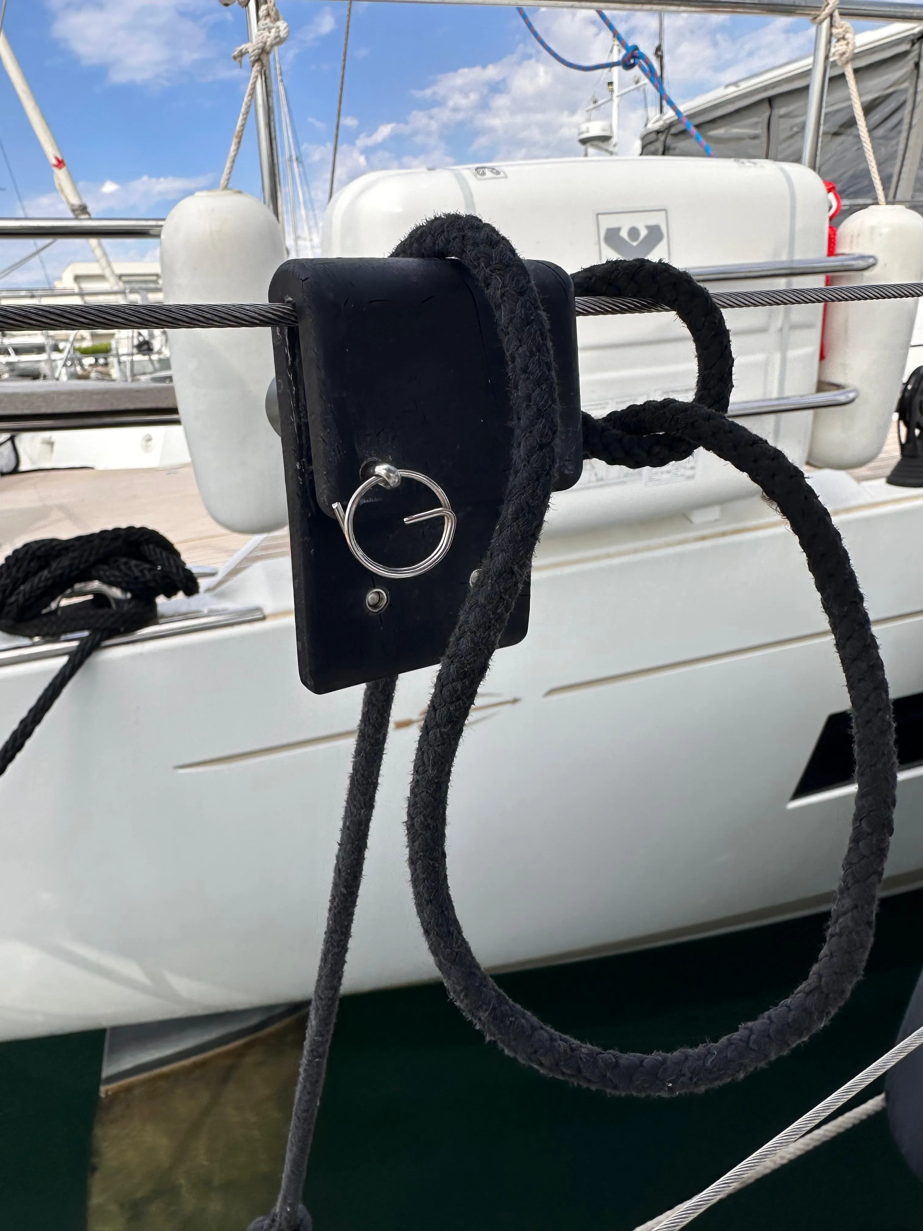 FENDLOCK clipped onto a sailboat lifeline, fender set at the right height